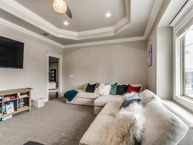7032 NW 159th Pl, Edmond, OK 73013 - living room featuring healthy amount of natural light, a tray ceiling, crown molding, carpet, and recessed lighting