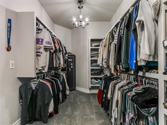 7032 NW 159th Pl, Edmond, OK 73013 - spacious closet with dark colored carpet and a chandelier