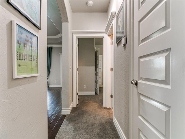 7032 NW 159th Pl, Edmond, OK 73013 - corridor featuring a textured wall and dark colored carpet