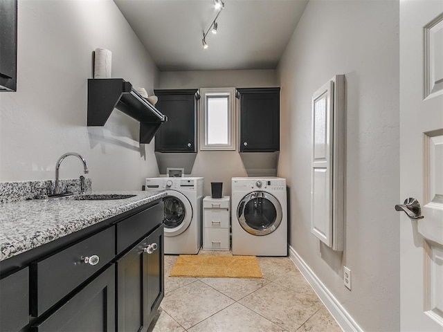 7032 NW 159th Pl, Edmond, OK 73013 - laundry area featuring cabinet space, independent washer and dryer, and light tile patterned floors