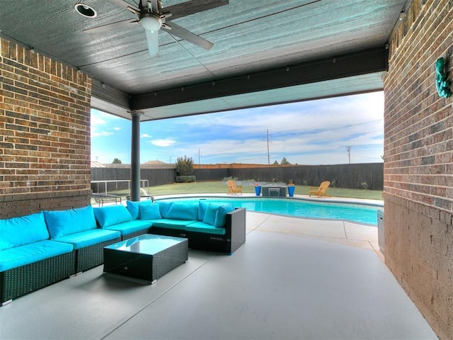 7032 NW 159th Pl, Edmond, OK 73013 - fenced backyard with outdoor lounge area, a patio, and a ceiling fan