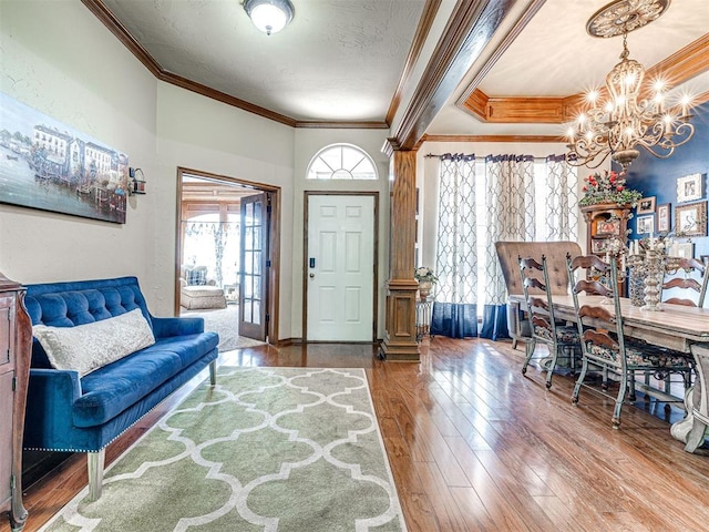 117 S Lexington Way, Edmond, OK 73012 - foyer entrance featuring a chandelier, crown molding, and hardwood / wood-style flooring