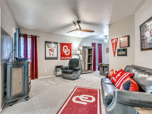 117 S Lexington Way, Edmond, OK 73012 - carpeted living room featuring ceiling fan, a textured ceiling, and a textured wall