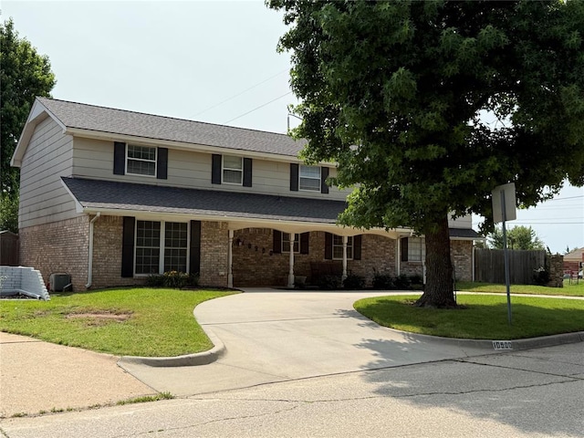 10900 Rock Ridge Rd, Oklahoma City, OK 73120 - traditional-style house with brick siding and curved driveway