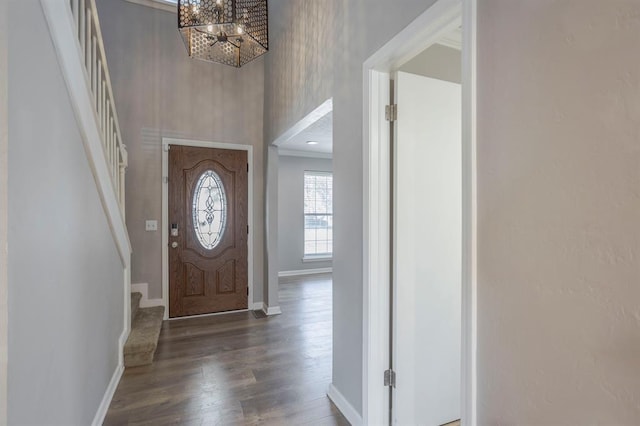 10900 Rock Ridge Rd, Oklahoma City, OK 73120 - entryway featuring stairs, a chandelier, wood finished floors, a towering ceiling, and crown molding