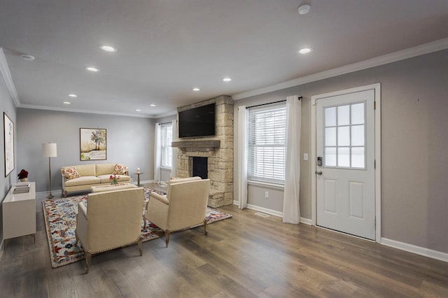 10900 Rock Ridge Rd, Oklahoma City, OK 73120 - living room featuring ornamental molding, recessed lighting, wood finished floors, and a fireplace