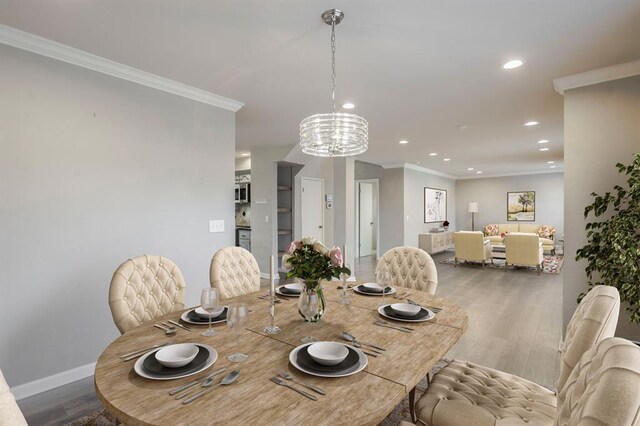 10900 Rock Ridge Rd, Oklahoma City, OK 73120 - dining area featuring recessed lighting, wood finished floors, crown molding, and a chandelier