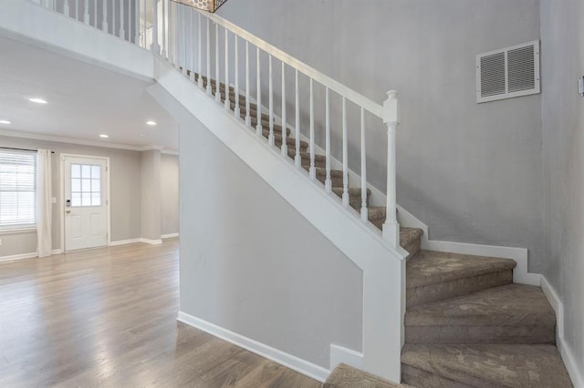 10900 Rock Ridge Rd, Oklahoma City, OK 73120 - stairs featuring crown molding, wood finished floors, and recessed lighting