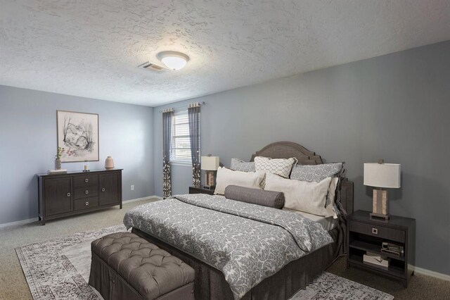 10900 Rock Ridge Rd, Oklahoma City, OK 73120 - bedroom with carpet floors and a textured ceiling