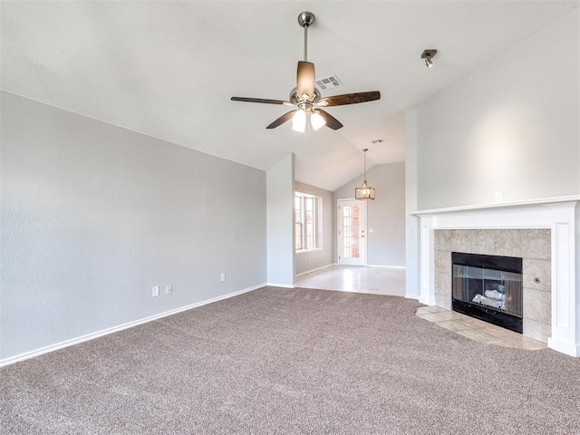 4917 SE 89th Ter, Oklahoma City, OK 73135 - unfurnished living room with carpet flooring, a ceiling fan, lofted ceiling, and a tiled fireplace