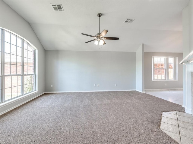 4917 SE 89th Ter, Oklahoma City, OK 73135 - carpeted spare room featuring ceiling fan, lofted ceiling, and a fireplace with flush hearth