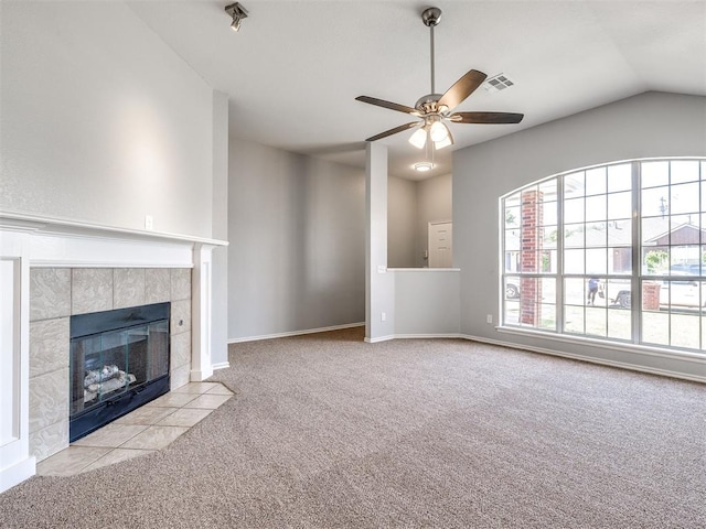 4917 SE 89th Ter, Oklahoma City, OK 73135 - unfurnished living room featuring carpet, ceiling fan, a tile fireplace, and vaulted ceiling
