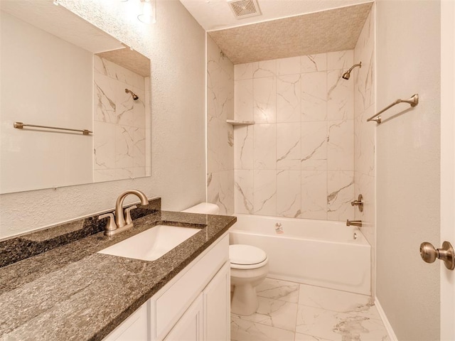 4917 SE 89th Ter, Oklahoma City, OK 73135 - bathroom featuring vanity, tub / shower combination, marble finish floors, a textured wall, and a textured ceiling