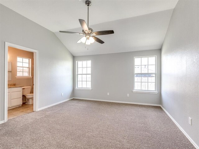 4917 SE 89th Ter, Oklahoma City, OK 73135 - empty room with light colored carpet, healthy amount of natural light, ceiling fan, and lofted ceiling