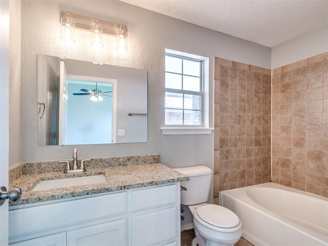 4917 SE 89th Ter, Oklahoma City, OK 73135 - full bathroom featuring vanity, a textured wall, ceiling fan, and tub / shower combination