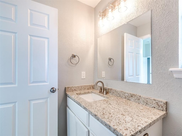4917 SE 89th Ter, Oklahoma City, OK 73135 - bathroom with vanity and a textured wall