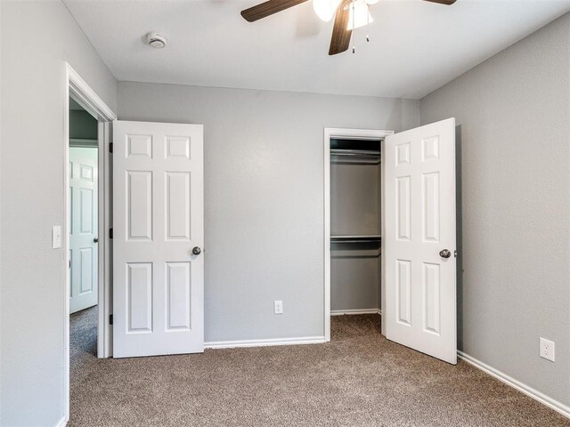 4917 SE 89th Ter, Oklahoma City, OK 73135 - unfurnished bedroom featuring carpet flooring, a closet, and a ceiling fan