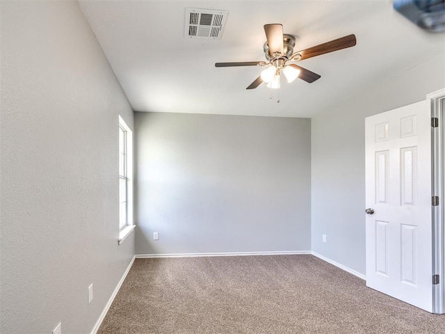 4917 SE 89th Ter, Oklahoma City, OK 73135 - spare room with ceiling fan and carpet flooring