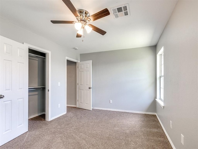 4917 SE 89th Ter, Oklahoma City, OK 73135 - unfurnished bedroom featuring carpet, a closet, and a ceiling fan