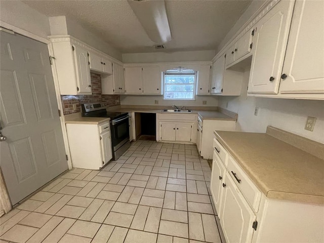 5333 Coble St, Oklahoma City, OK 73135 - kitchen featuring electric stove, brick patterned flooring, white cabinets, backsplash, and a textured ceiling