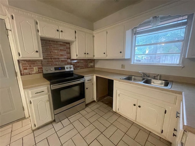 5333 Coble St, Oklahoma City, OK 73135 - kitchen featuring stainless steel electric range, light countertops, white cabinetry, and tasteful backsplash