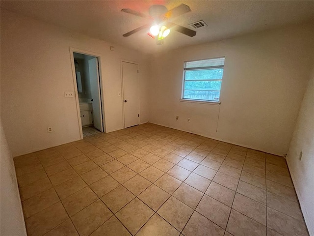 5333 Coble St, Oklahoma City, OK 73135 - empty room with a ceiling fan and light tile patterned floors