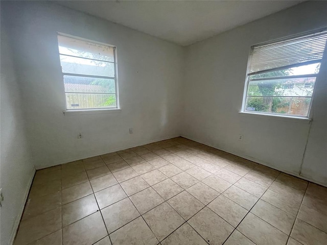 5333 Coble St, Oklahoma City, OK 73135 - spare room with healthy amount of natural light and light tile patterned floors