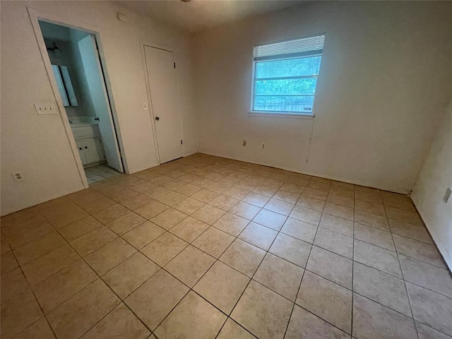 5333 Coble St, Oklahoma City, OK 73135 - unfurnished bedroom featuring light tile patterned floors