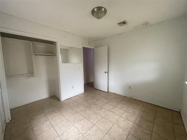 5333 Coble St, Oklahoma City, OK 73135 - unfurnished bedroom featuring light tile patterned floors and a closet
