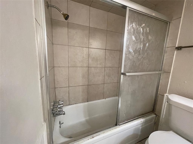 5333 Coble St, Oklahoma City, OK 73135 - bathroom featuring toilet and combined bath / shower with glass door