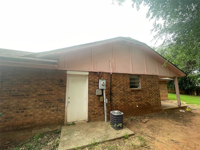 5333 Coble St, Oklahoma City, OK 73135 - back of house featuring brick siding and board and batten siding
