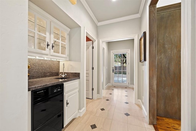 1608 Mulholland Dr, Edmond, OK 73003 - indoor wet bar featuring dishwasher, light tile patterned floors, crown molding, and tasteful backsplash