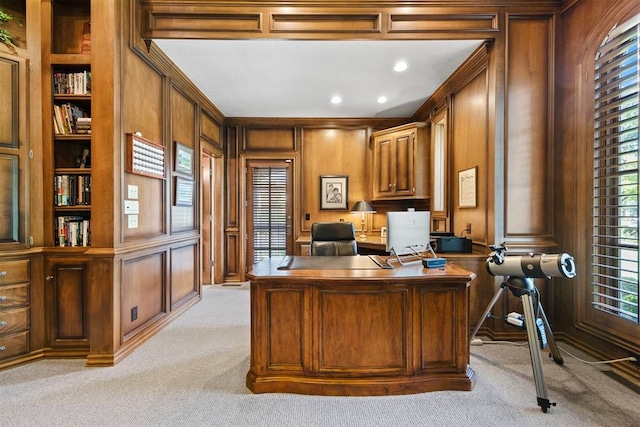 1608 Mulholland Dr, Edmond, OK 73003 - office area with light carpet, built in features, wood walls, ornamental molding, and a decorative wall