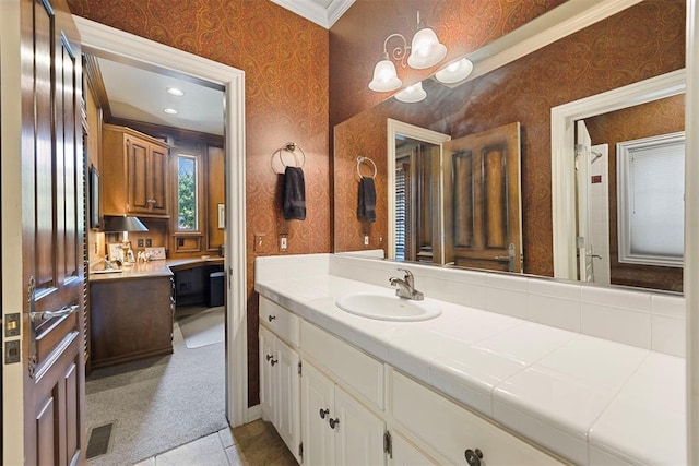 1608 Mulholland Dr, Edmond, OK 73003 - bathroom featuring wallpapered walls, vanity, crown molding, and a chandelier