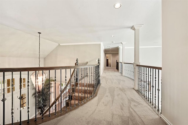 1608 Mulholland Dr, Edmond, OK 73003 - hall featuring carpet, decorative columns, crown molding, recessed lighting, and an upstairs landing