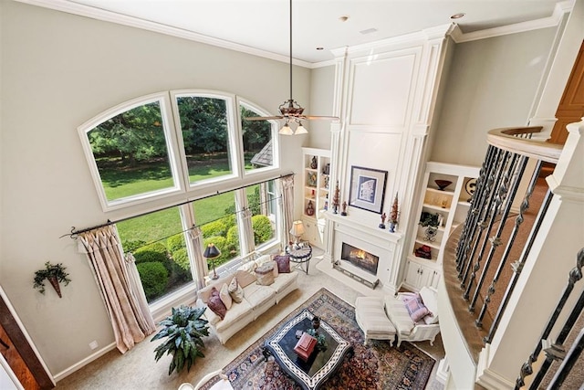 1608 Mulholland Dr, Edmond, OK 73003 - living area with a large fireplace and crown molding