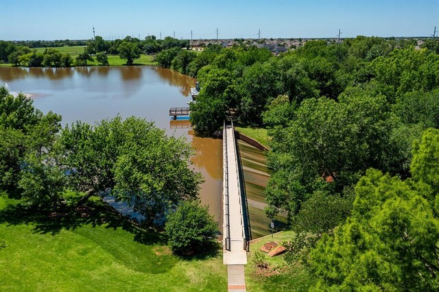 1608 Mulholland Dr, Edmond, OK 73003 - aerial view of a nearby body of water and a tree filled landscape