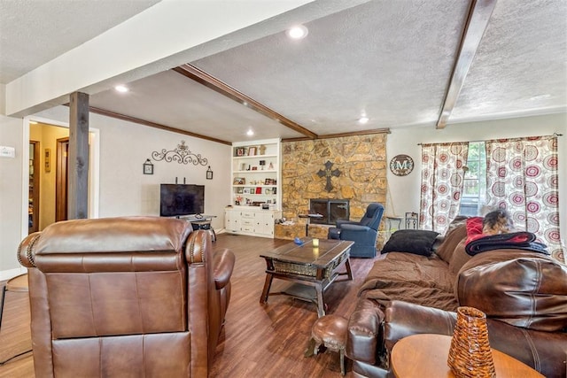 11900 Surrey Ln, Yukon, OK 73099 - living area featuring wood finished floors, beamed ceiling, a textured ceiling, and recessed lighting
