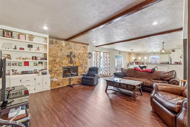 11900 Surrey Ln, Yukon, OK 73099 - living area with a textured ceiling, dark wood finished floors, and beam ceiling