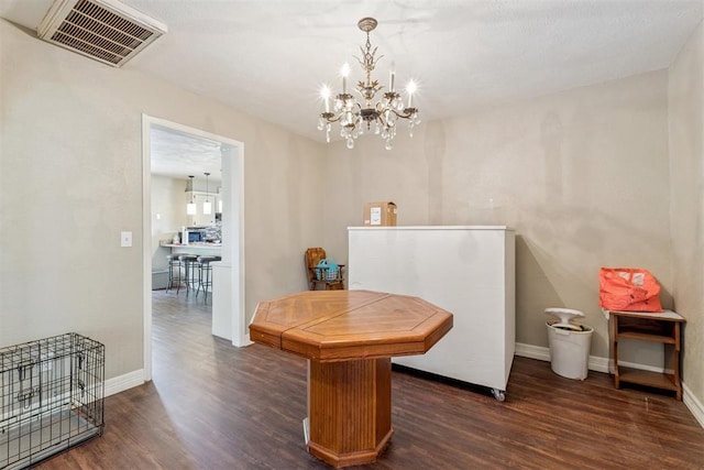 11900 Surrey Ln, Yukon, OK 73099 - dining area featuring dark wood-style flooring and a chandelier