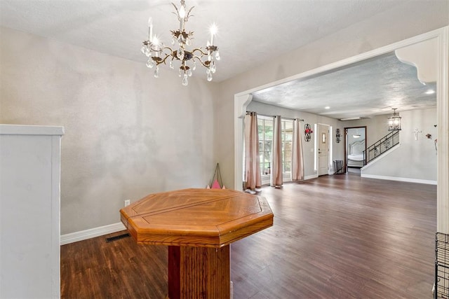 11900 Surrey Ln, Yukon, OK 73099 - dining area with wood finished floors, stairway, and a chandelier