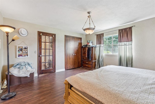11900 Surrey Ln, Yukon, OK 73099 - bedroom with wood finished floors and baseboards