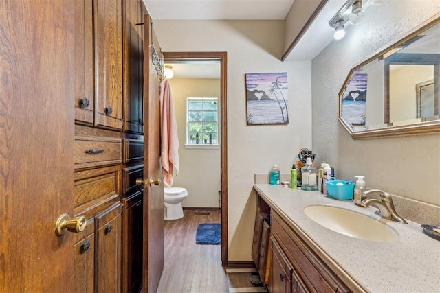 11900 Surrey Ln, Yukon, OK 73099 - bathroom with vanity and wood finished floors