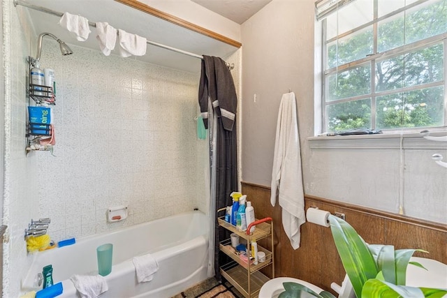11900 Surrey Ln, Yukon, OK 73099 - full bathroom featuring shower / bath combo and a wainscoted wall
