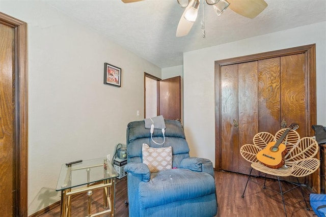 11900 Surrey Ln, Yukon, OK 73099 - sitting room with a ceiling fan and wood finished floors