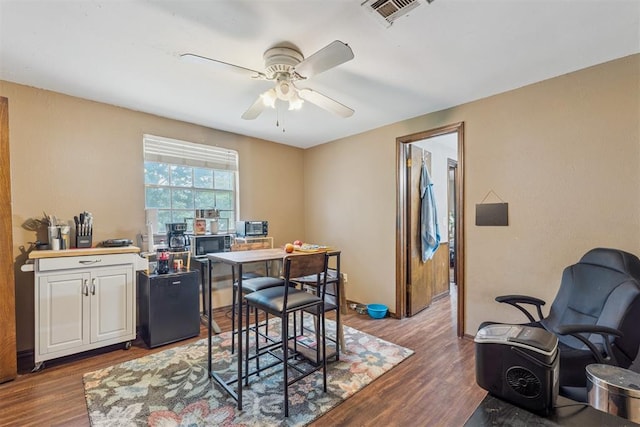 11900 Surrey Ln, Yukon, OK 73099 - dining area with ceiling fan, dark wood-style floors, and a desk