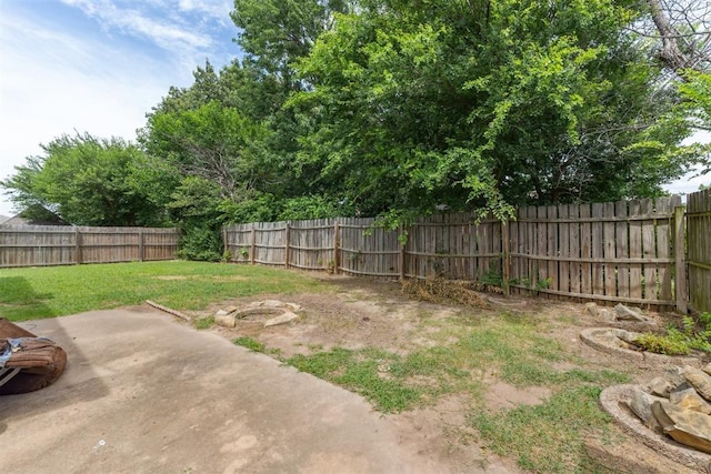 11900 Surrey Ln, Yukon, OK 73099 - fenced backyard featuring a patio area