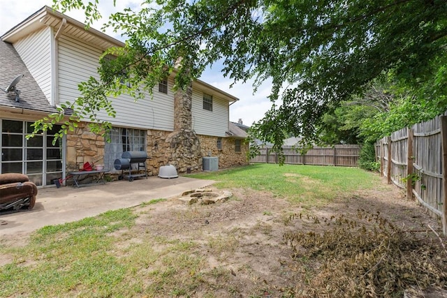11900 Surrey Ln, Yukon, OK 73099 - fenced backyard featuring a patio area