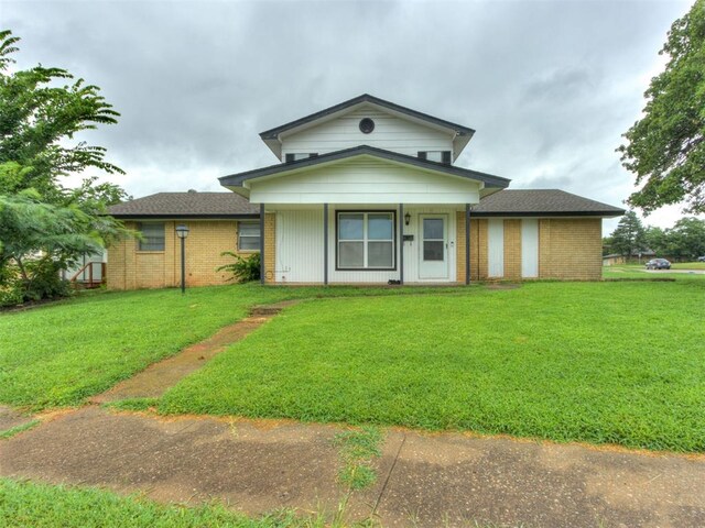 4113 Clendon Way, Del City, OK 73115 - view of front facade with brick siding and a front lawn