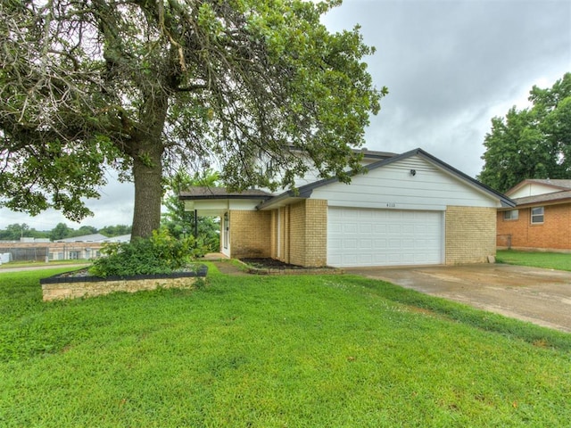4113 Clendon Way, Del City, OK 73115 - view of front of house featuring brick siding, an attached garage, a front yard, and concrete driveway